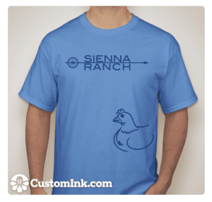A man wearing a Green Goat T-shirt that says Sienna Ranch.