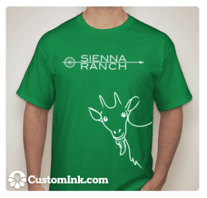 A man wearing a Green Goat T-Shirt that says sienna ranch.