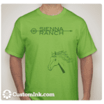 A man wearing a Green Goat T-shirt that says sienna ranch.