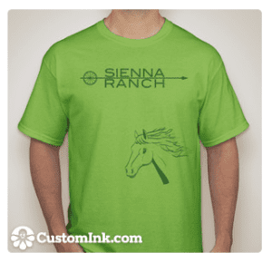 A man wearing a Green Goat T-shirt that says sienna ranch.